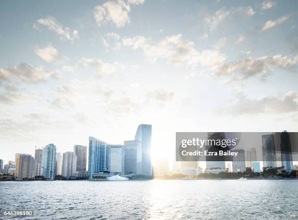 view of the miami skyline at sunset - bright sky stock pictures, royalty-free photos & images