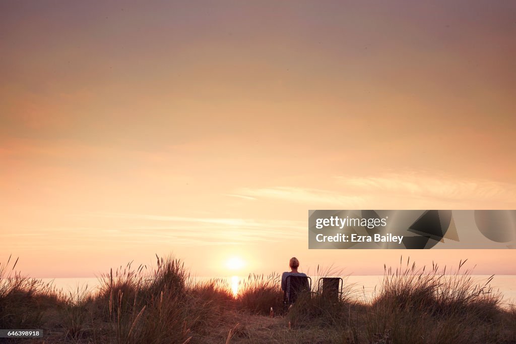 Woman watching the sun set