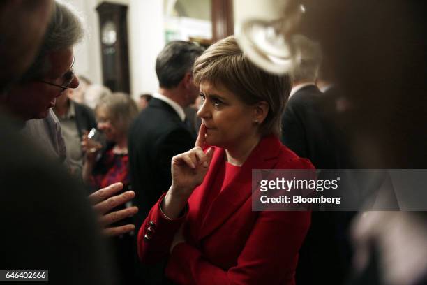 Nicola Sturgeon, Scotland's first minister and leader of the Scottish National Party , center, speaks with delegates after a speech at a David Hume...