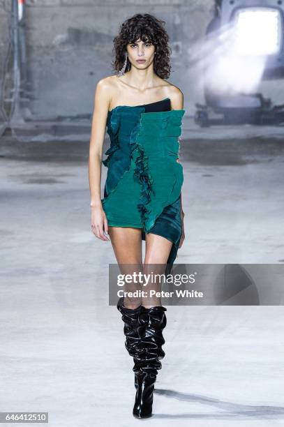 Mica Arganaraz walks the runway during the Saint Laurent show as part of the Paris Fashion Week Womenswear Fall/Winter 2017/2018 >> on February 28,...