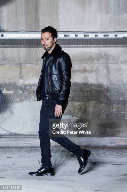 Designer Anthony Vaccarello walks the runway after the Saint Laurent show as part of the Paris Fashion Week Womenswear Fall/Winter 2017/2018 >> on...