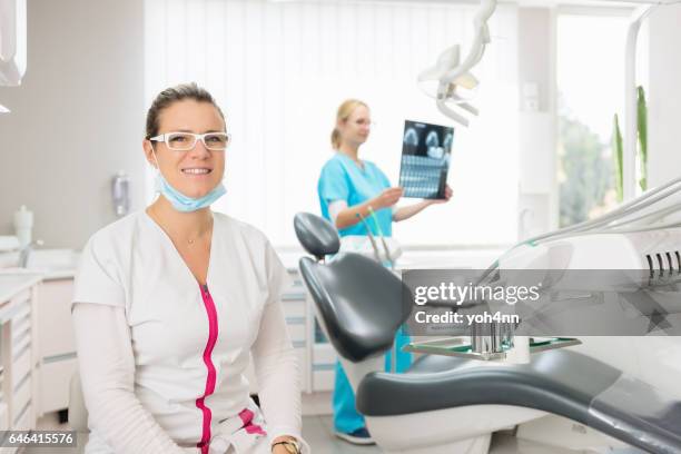 dental team at dentist office - dental record stock pictures, royalty-free photos & images