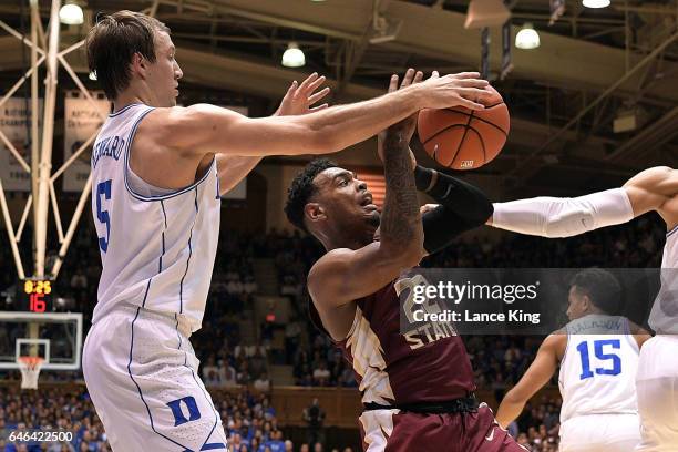 Luke Kennard of the Duke Blue Devils tries to steal the ball from Xavier Rathan-Mayes of the Florida State Seminoles at Cameron Indoor Stadium on...