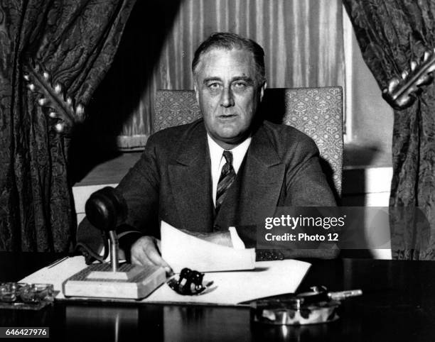 Franklin Delano Roosevelt , 32nd President of the United States of America , giving one of his 'fireside' broadcasts to the American nation.