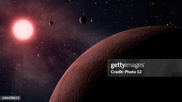 This artist's concept depicts a system, called KOI-961, that hosts the three smallest exoplanets known so far to orbit a star other than our sun.