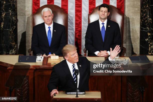 President Donald Trump addresses a joint session of the U.S. Congress as Vice President Mike Pence and House Speaker Rep. Paul Ryan look on on...