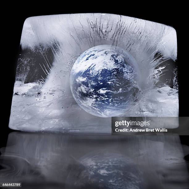 planet earth frozen in a block of ice - eiszeit stock-fotos und bilder