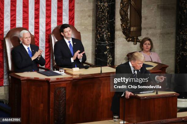 President Donald Trump addresses a joint session of the U.S. Congress as Vice President Mike Pence and House Speaker Rep. Paul Ryan look on on...