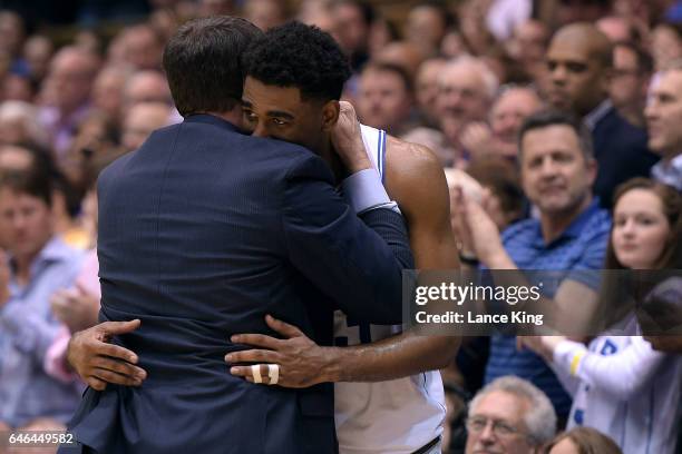 Head coach Mike Krzyzewski hugs Matt Jones of the Duke Blue Devils near the end of their game against the Florida State Seminoles at Cameron Indoor...