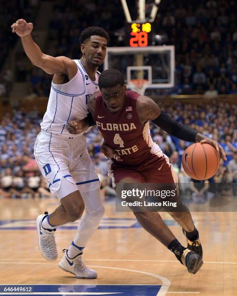 Dwayne Bacon of the Florida State Seminoles drives against Matt Jones of the Duke Blue Devils at Cameron Indoor Stadium on February 28, 2017 in...