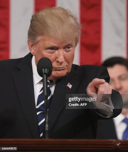 President Donald J. Trump delivers his first address to a joint session of Congress from the floor of the House of Representatives in Washington, DC,...