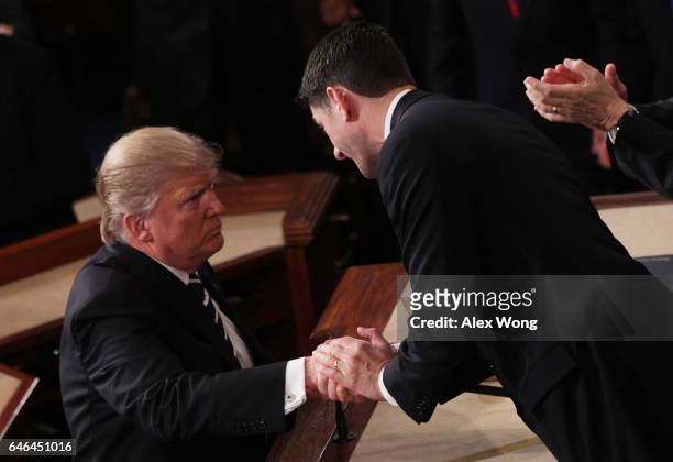 President Donald Trump shakes hands with House Speaker Rep. Paul Ryan after addressing a joint session of the U.S. Congress on February 28, 2017 in...