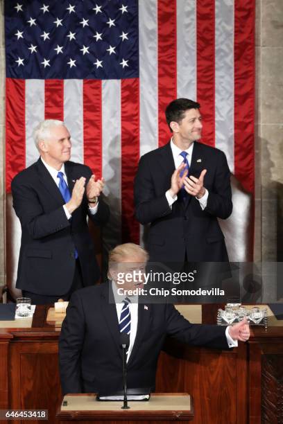 President Donald Trump addresses a joint session of the U.S. Congress as Vice President Mike Pence and House Speaker Rep. Paul Ryan look on on...