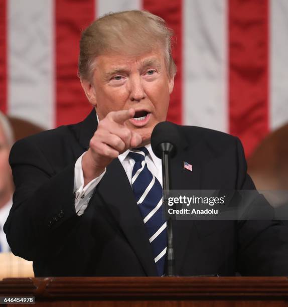 President Donald J. Trump delivers his first address to a joint session of Congress from the floor of the House of Representatives in Washington,...