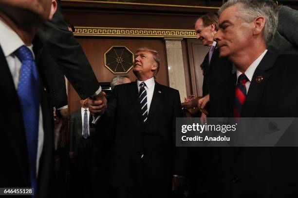 President Donald J. Trump arrives to deliver his first address to a joint session of Congress from the floor of the House of Representatives in...