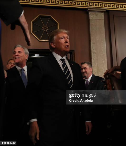 President Donald J. Trump arrives to deliver his first address to a joint session of Congress from the floor of the House of Representatives in...