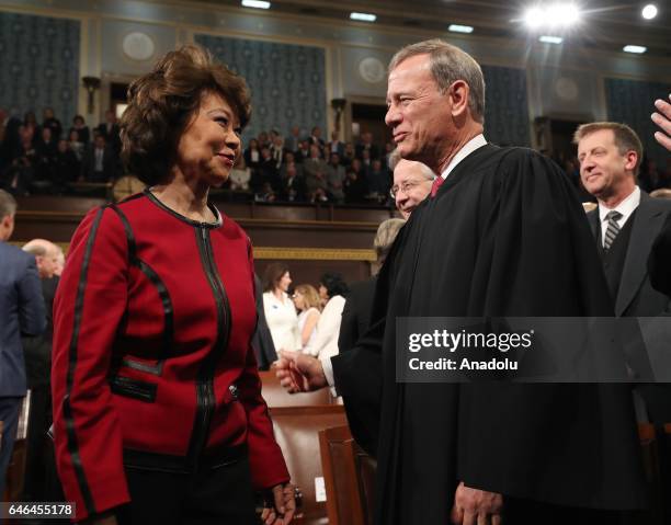 Secretary of Transportation Elaine Chao and Chief Justice John Roberts arrive for US President Donald J. Trump's first address to a joint session of...