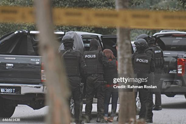 Doan Thi Huong, one of the suspect leaves under heavy security presence at Sepang Magistrate Court on March 1st 2017 in Sepang, Selangor. Kim...