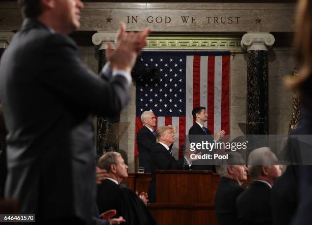 President Donald Trump and the entire chamber reacts towards Carryn Owens, widow of Navy Seal Ryan Owens, as Trump delivers his first address to a...