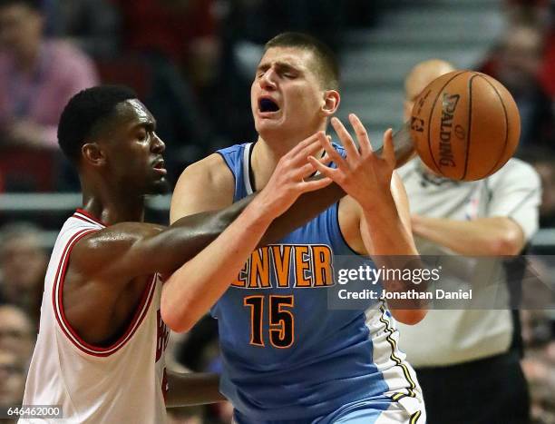 Bobby Portis of the Chicago Bulls fouls Nikola Jokic of the Denver Nuggets at the United Center on February 28, 2017 in Chicago, Illinois. The...