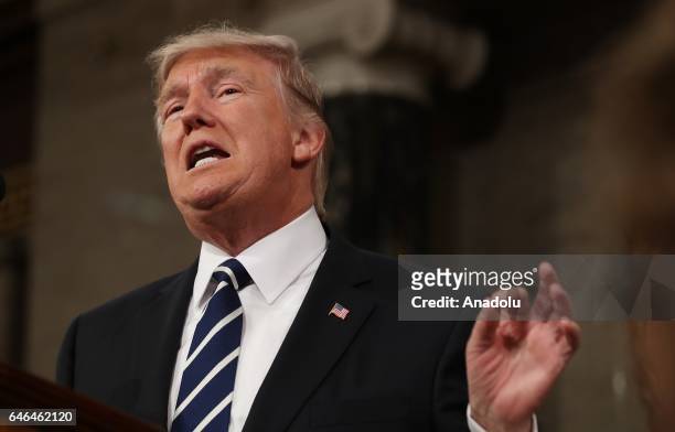 President Donald J. Trump delivers his first address to a joint session of Congress from the floor of the House of Representatives in Washington,...