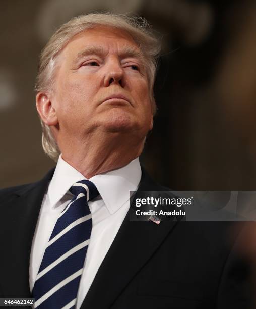 President Donald J. Trump delivers his first address to a joint session of Congress from the floor of the House of Representatives in Washington,...