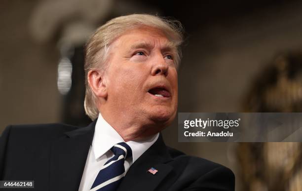 President Donald J. Trump delivers his first address to a joint session of Congress from the floor of the House of Representatives in Washington,...