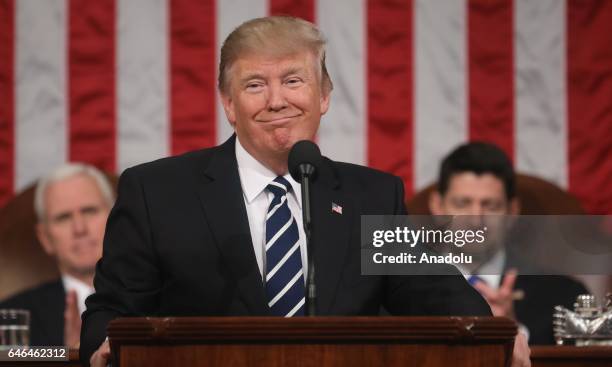 President Donald J. Trump delivers his first address to a joint session of Congress from the floor of the House of Representatives in Washington,...