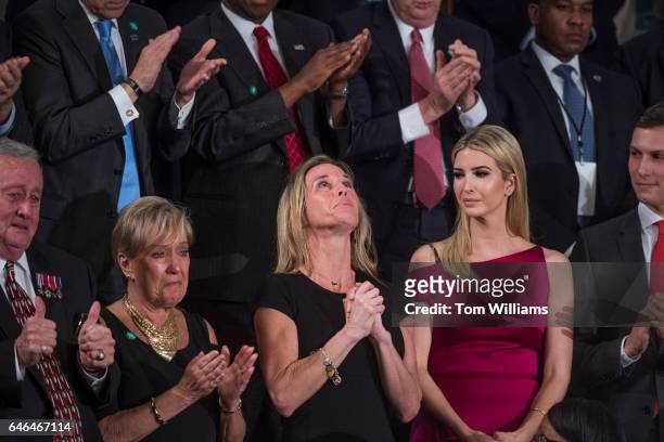 Carryn Owens, widow of Navy SEAL William Ryan Owens, reacts after being recognized by President Donald Trump during his address to a joint session of...
