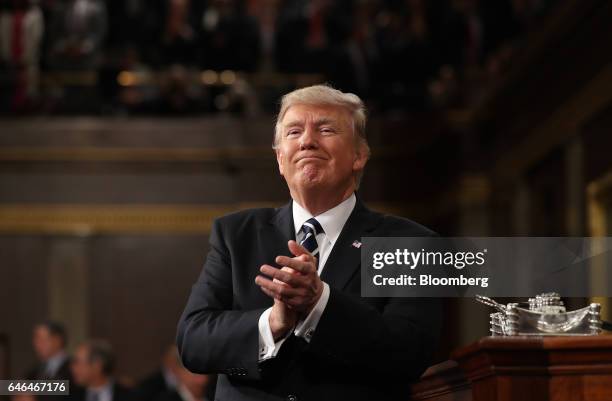 President Donald Trump applauds during a joint session of Congress in Washington, D.C., U.S., on Tuesday, Feb. 28, 2017. Trump will press Congress to...