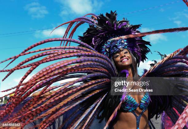 Miss Universe 1998 Wendy Fitzwilliam masquerades with Harts mas band presenting 'Ultra Violet Jungle' during Trinidad Carnival 2017 at the Queen's...