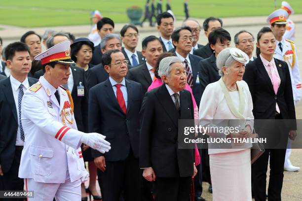 Japanese Emperor Akihito and Empress Michiko attend a wreath laying ceremony at the mausoleum of Vietnamese late President Ho Chi Minh in Hanoi on...