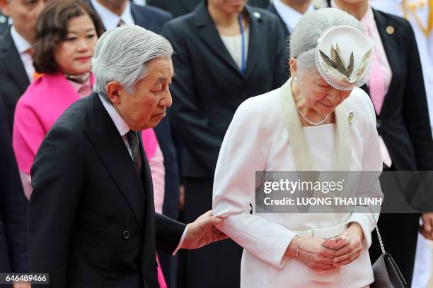 Japanese Emperor Akihito and Empress Michiko attend a wreath laying ceremony at the mausoleum of Vietnamese late President Ho Chi Minh in Hanoi on...