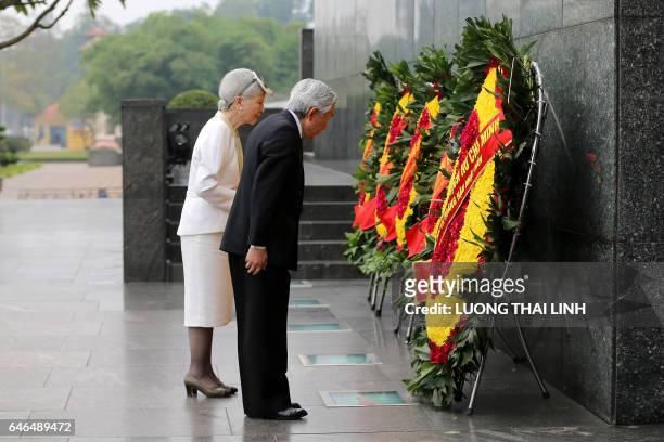 Japanese Emperor Akihito and Empress Michiko attend a wreath laying ceremony at the mausoleum of Vietnamese late President Ho Chi Minh in Hanoi on...