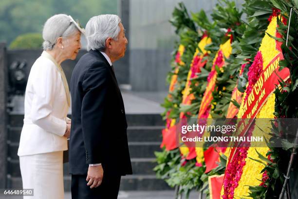 Japanese Emperor Akihito and Empress Michiko attend a wreath laying ceremony at the mausoleum of Vietnamese late President Ho Chi Minh in Hanoi on...