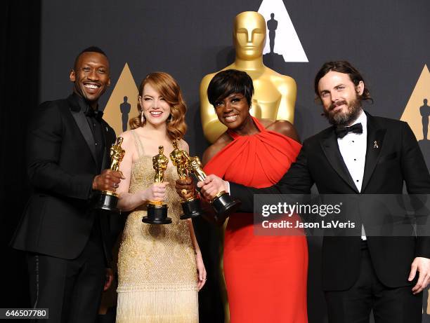 Actors Mahershala Ali, Emma Stone, Viola Davis and Casey Affleck pose in the press room at the 89th annual Academy Awards at Hollywood & Highland...