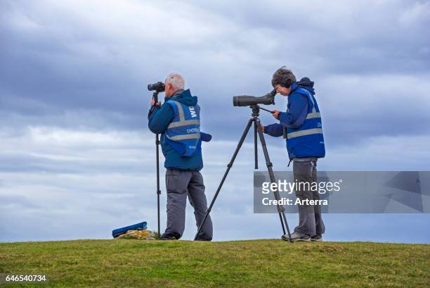 Whale and dolphin watchers looking for marine wildlife at Stoer Head / Stoerhead, Sutherland, Scottish Highlands, Scotland.