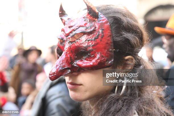 Masked procession in the old part of Naples, in the day of the Mardi Gras parade through the streets of downtown.