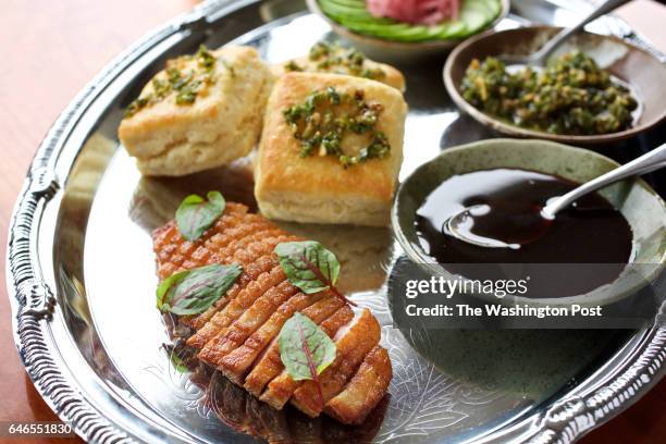 Peking Duck Breast, Hoisin, Cucumber and Scallion and Fluffy Buttermilk Biscuits for the table photographed at Himitsu in Washington, DC. .