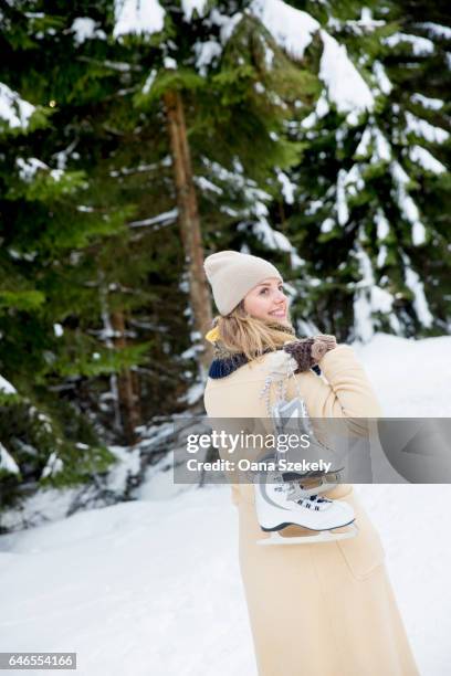 young woman enjoying the snow and the nature - spielerisch stock pictures, royalty-free photos & images