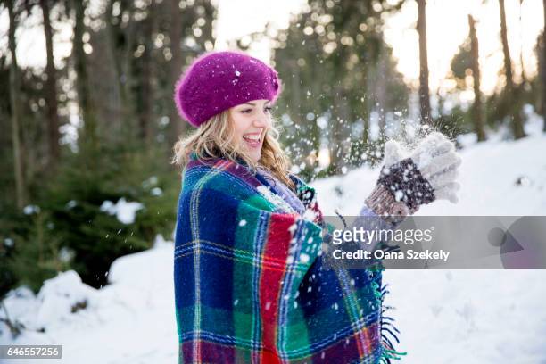 young woman enjoying the snow and the nature - spielerisch stock pictures, royalty-free photos & images