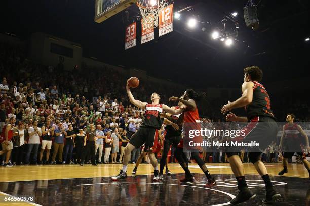 Andrew Ogilvy of the Hawks takes a rebound during game two of the NBL Grand Final series between the Perth Wildcats and the Illawarra Hawks at WIN...