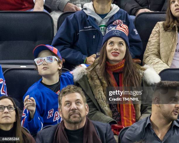 Debra Messing and Roman Walker Zelman are seen at Madison Square Garden on February 28, 2017 in New York City.