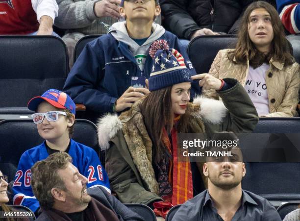 Debra Messing and Roman Walker Zelman are seen at Madison Square Garden on February 28, 2017 in New York City.