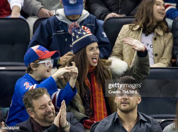 Debra Messing and Roman Walker Zelman are seen at Madison Square Garden on February 28, 2017 in New York City.