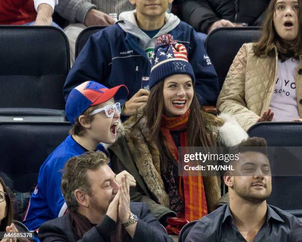 Debra Messing and Roman Walker Zelman are seen at Madison Square Garden on February 28, 2017 in New York City.