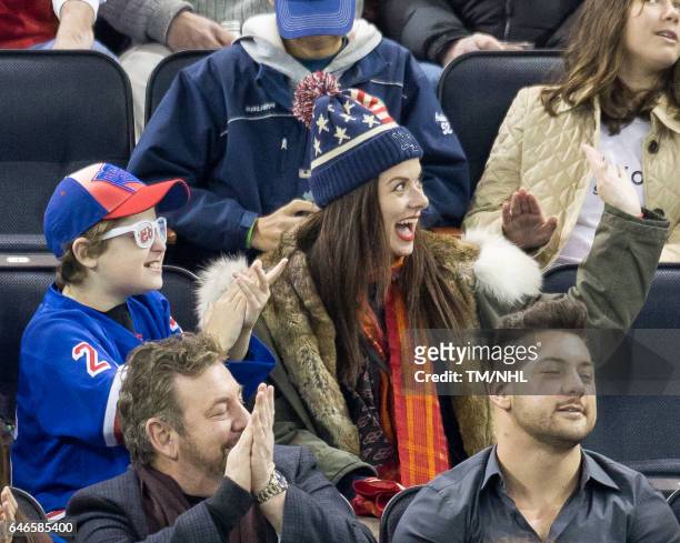 Debra Messing and Roman Walker Zelman are seen at Madison Square Garden on February 28, 2017 in New York City.