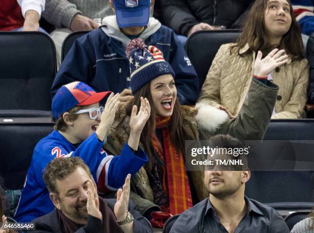 Debra Messing and Roman Walker Zelman are seen at Madison Square Garden on February 28, 2017 in New York City.