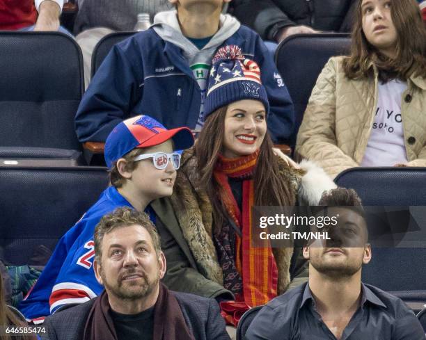 Debra Messing and Roman Walker Zelman are seen at Madison Square Garden on February 28, 2017 in New York City.