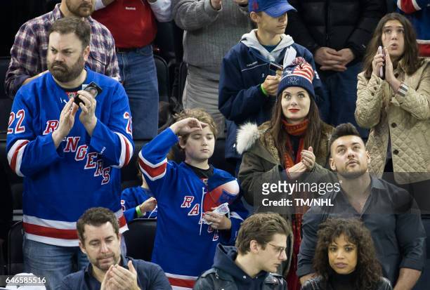 Christopher Roach, Debra Messing and Roman Walker Zelman are seen at Madison Square Garden on February 28, 2017 in New York City.